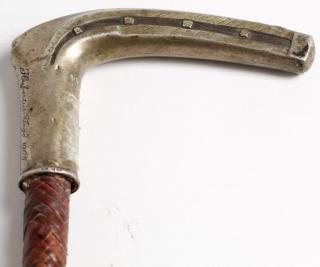 Appraisal: Militaria German the L-shaped handle with impressed design similar to