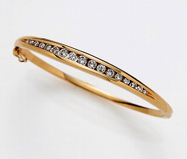 Appraisal: A diamond and fourteen karat gold bangle bracelet estimated total