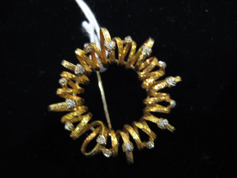 Appraisal: DIAMOND CIRCLE BROOCH k textured yellow gold oval loops on