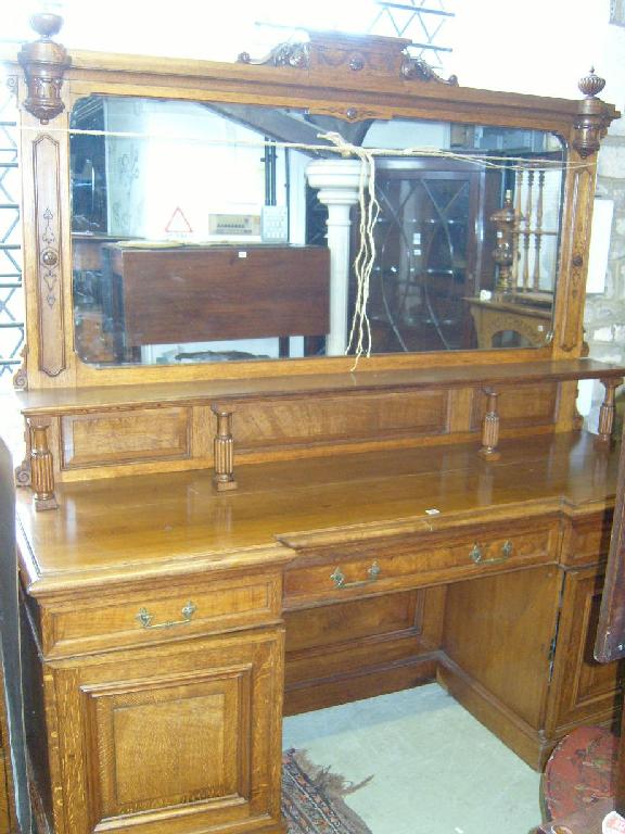 Appraisal: A substantial Victorian oak mirror back sideboard the upper section