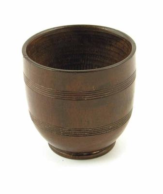 Appraisal: An early th century turned lignum vitae dipper cup with