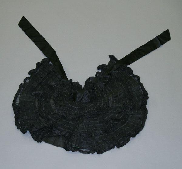 Appraisal: Victorian clothing ruffles and horizontal bands over liner satin bow