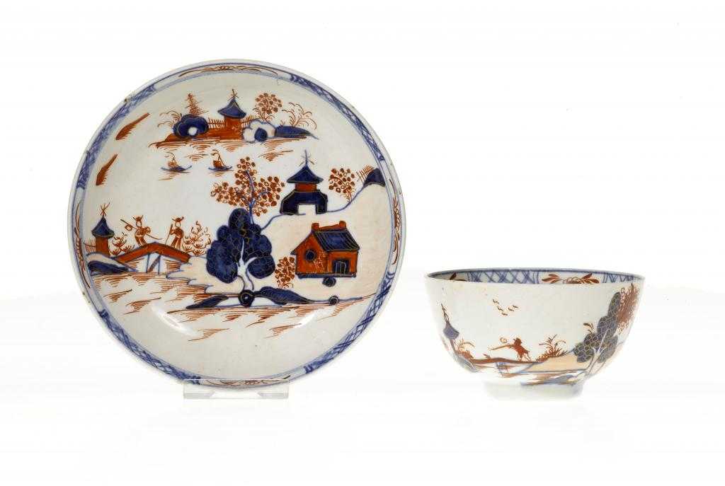 Appraisal: A LOWESTOFT TEA BOWL AND SAUCER painted in underglaze blue