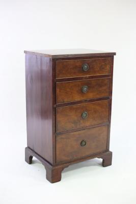 Appraisal: A narrow mahogany chest of four drawers on bracket feet