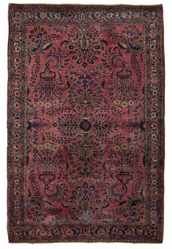 Appraisal: A Sarouk Wool Rug with allover foliate decoration on a