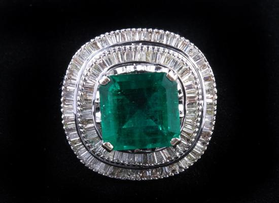 Appraisal: K WHITE GOLD DIAMOND AND EMERALD RING Emerald-cut emerald weighing