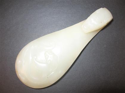 Appraisal: Chinese white jade garment hook th century large lobe-shaped body