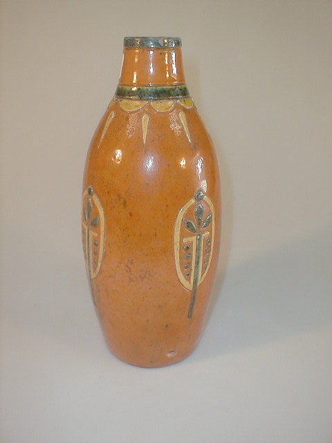 Appraisal: A terracotta ovoid vase the narrow neck banded in green