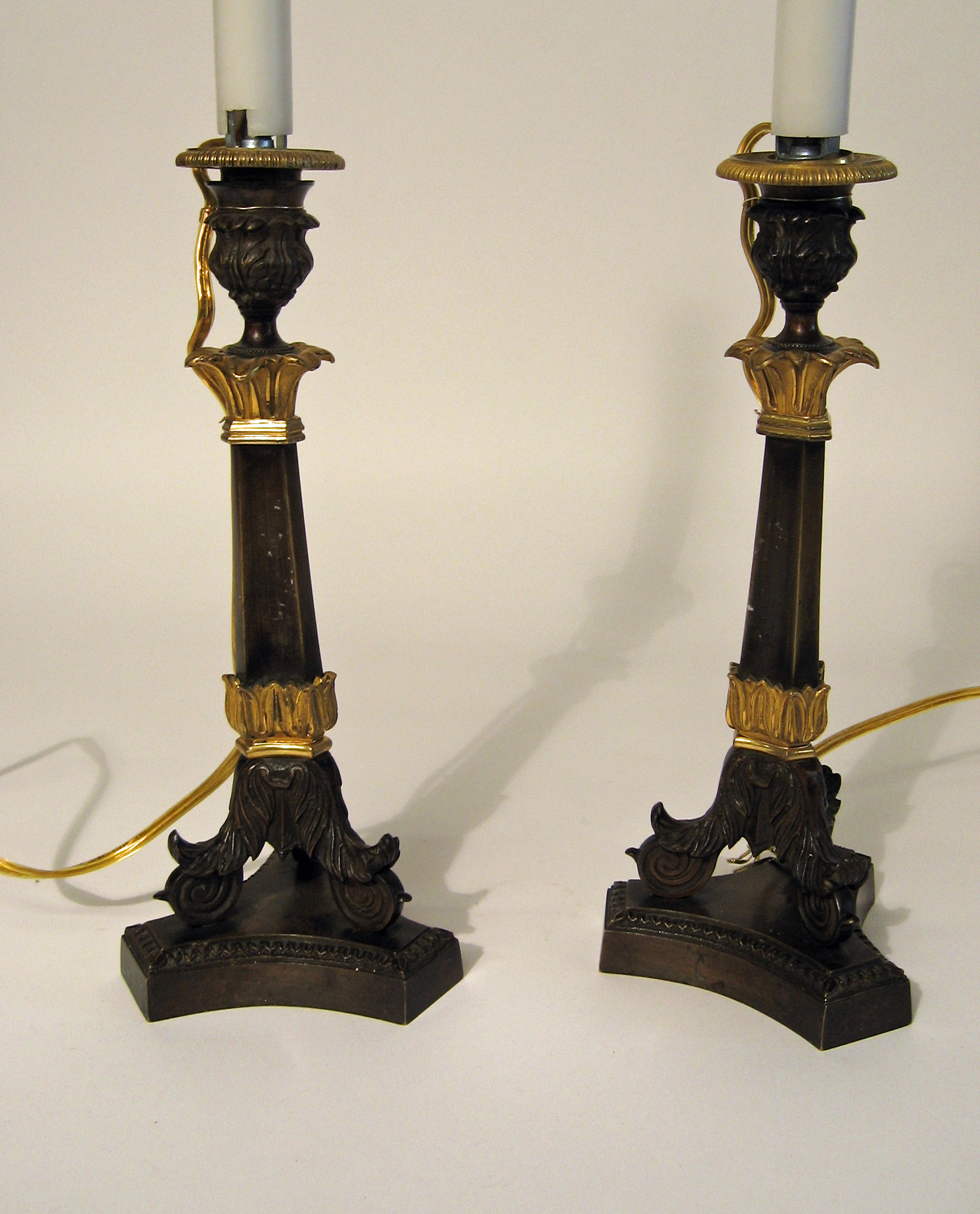 Appraisal: Pair of Empire ormolu and patinated bronze candlesticks th century