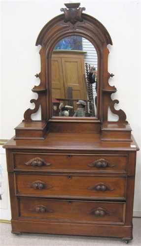 Appraisal: A VICTORIAN WALNUT DRESSER WITH MIRROR American late th century