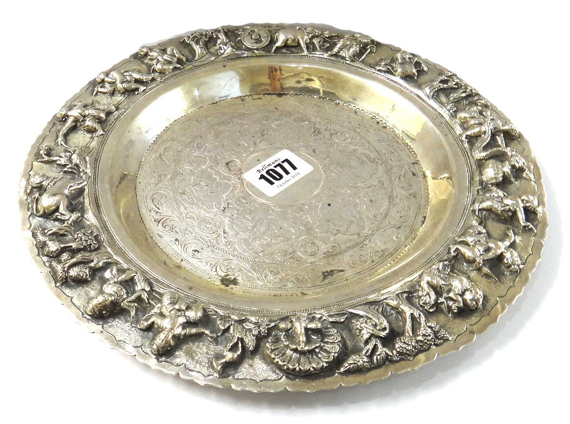 Appraisal: An Oriental circular dish decorated with a peacock and with