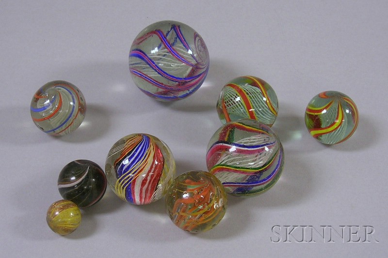 Appraisal: Nine Glass Marbles including latticino core divided core ribbon goldstone