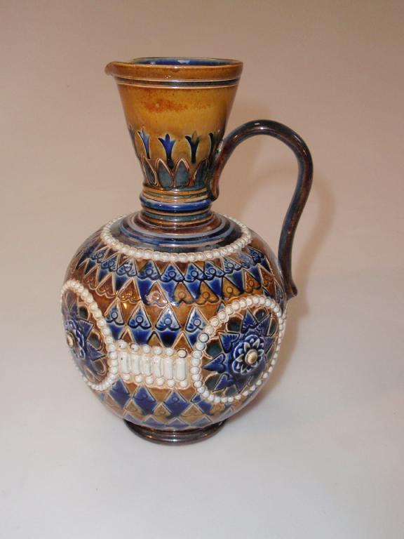 Appraisal: A Doulton Lambeth stoneware flagon of ovoid form with strap