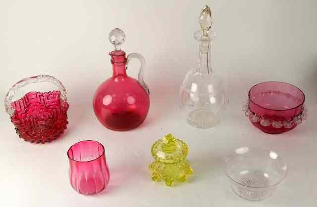 Appraisal: A ruby tinted glass carafe with clear entwined glass handle