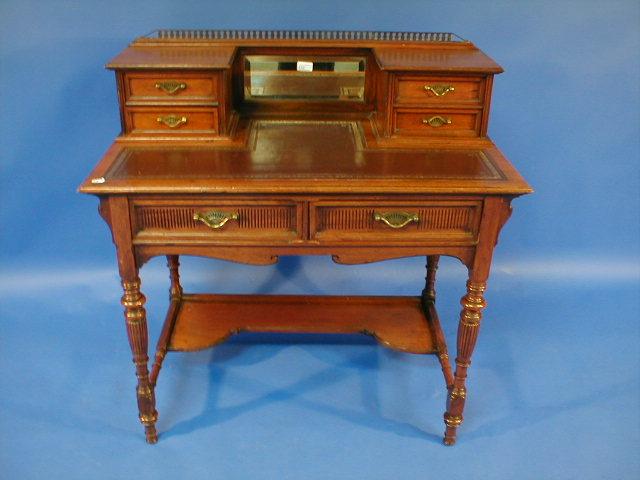 Appraisal: A late Victorian walnut escritoire with galleried mirrored and drawer