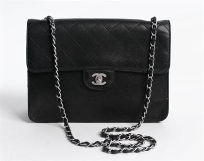 Appraisal: Chanel black quilted handbag Matte black calfskin with front-flap and