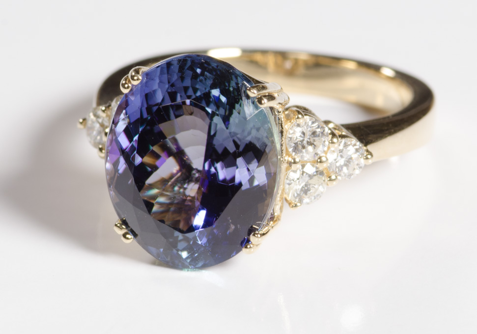 Appraisal: TANZANITE DIAMOND AND FOURTEEN KARAT GOLD RING centering a large