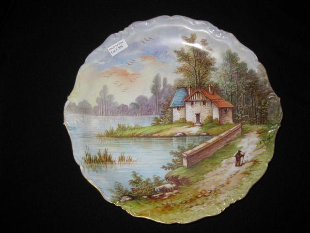 Appraisal: Limoges Handpainted Porcelain Charger waterfront landscape with cottage artist signed