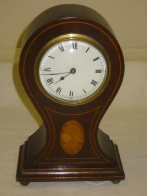 Appraisal: AN EDWARDIAN MANTEL CLOCK the French eight day cylinder movement