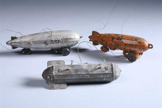 Appraisal: TWO CAST IRON ZEPPELIN TOYS With painted tin Zeppelin PROVENANCE