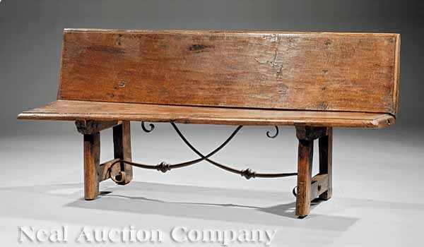 Appraisal: A Spanish Colonial Oak Bench having a plank back and