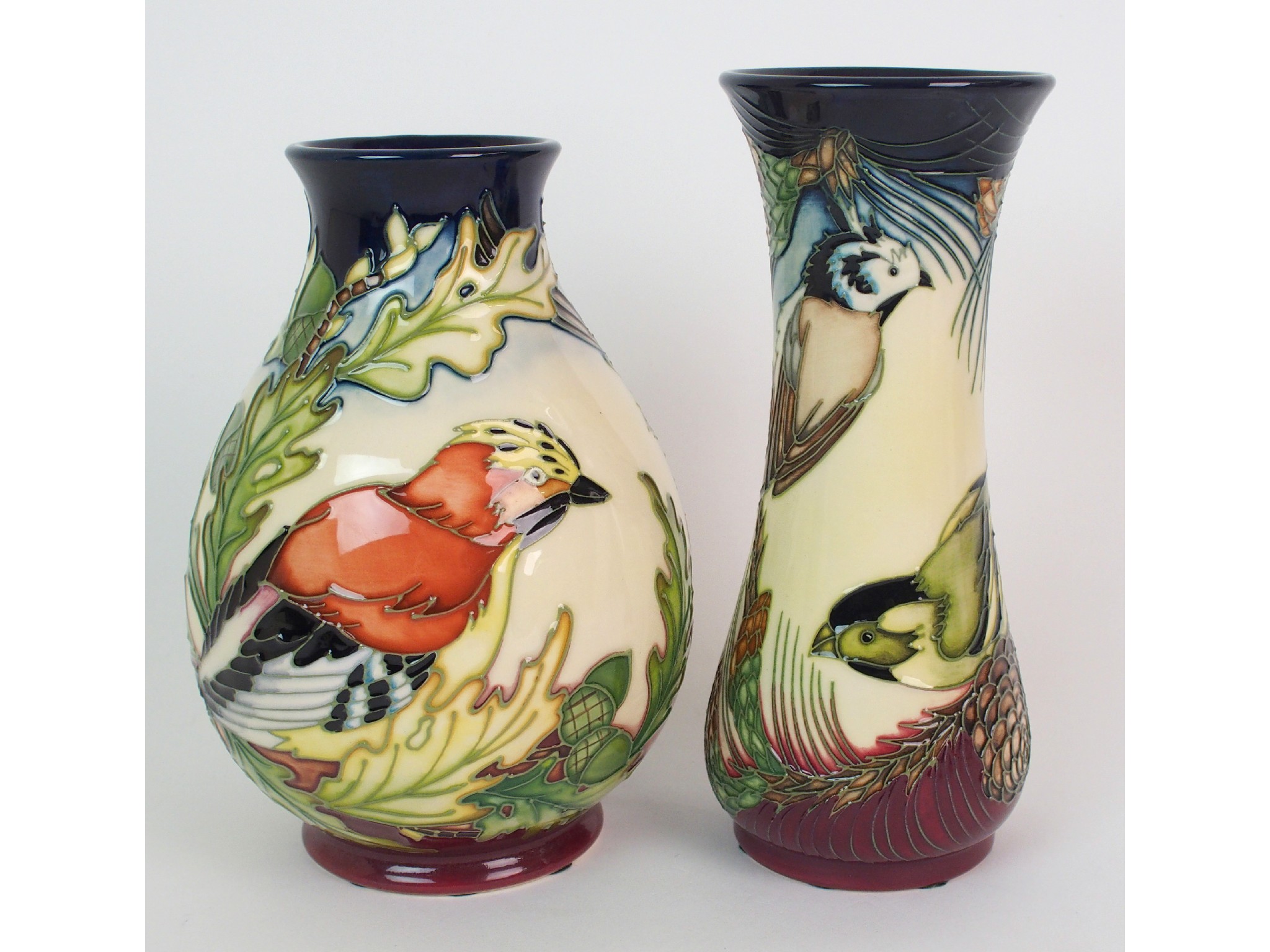 Appraisal: Two Moorcroft Pottery Ingleswood vases designed by Philip Gibsonthe first