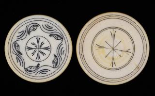 Appraisal: Two Scrimshawed Ivory Poker Chips American ca Images of fancy