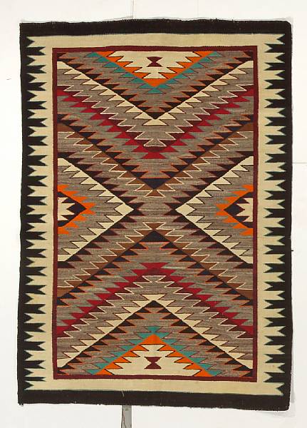 Appraisal: A Navajo Red Mesa rug Concentric sawtooth diamond halves within