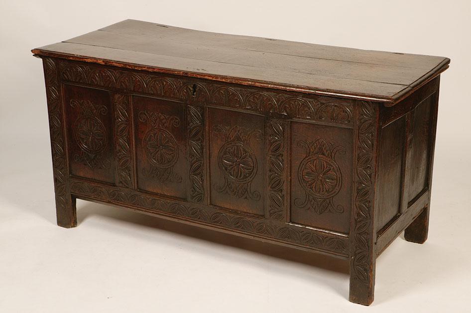 Appraisal: A CHARLES II OAK COFFER the plank construction top with