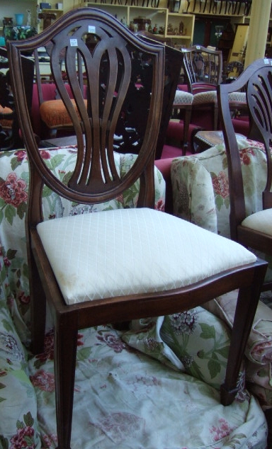 Appraisal: A matched set of nine George III style mahogany dining