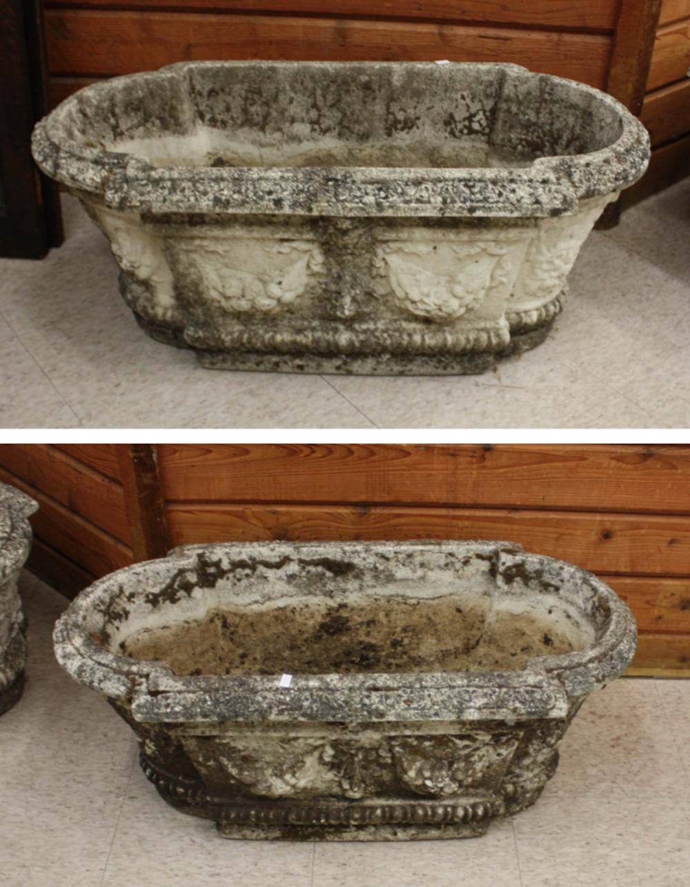 Appraisal: PAIR OF CLASSICAL CONCRETE GARDEN PLANTERS oblong form with side