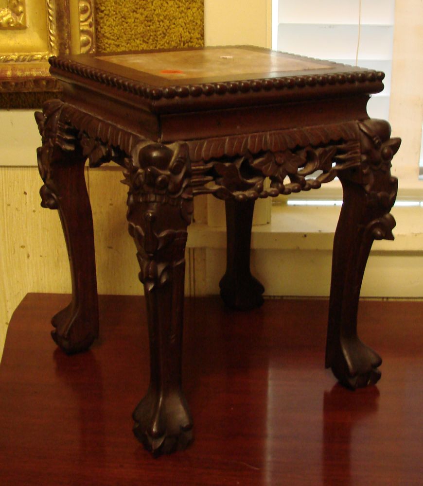 Appraisal: CARVED TEAKWOOD STAND Chinese th CenturyWith rouge marble top Claw