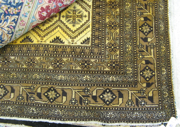 Appraisal: PERSIAN CARPET repeating rows of geometrics-filled diamonds on browns on