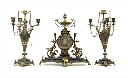 Appraisal: Neo-Grec Parcel-Gilt and Patinated Metal Three-Piece Mantel Clock Garniture Comprising