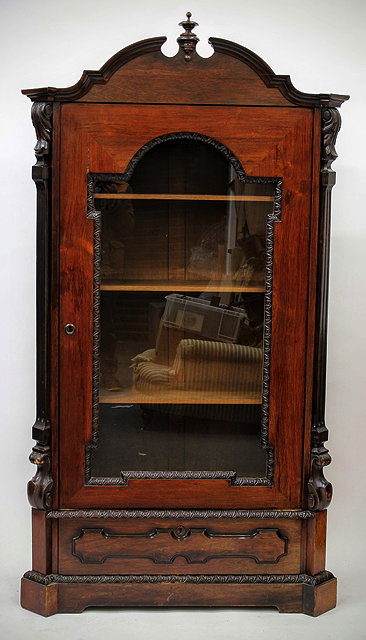 Appraisal: A LATE TH EARLY TH CENTURY CABINET with an arching