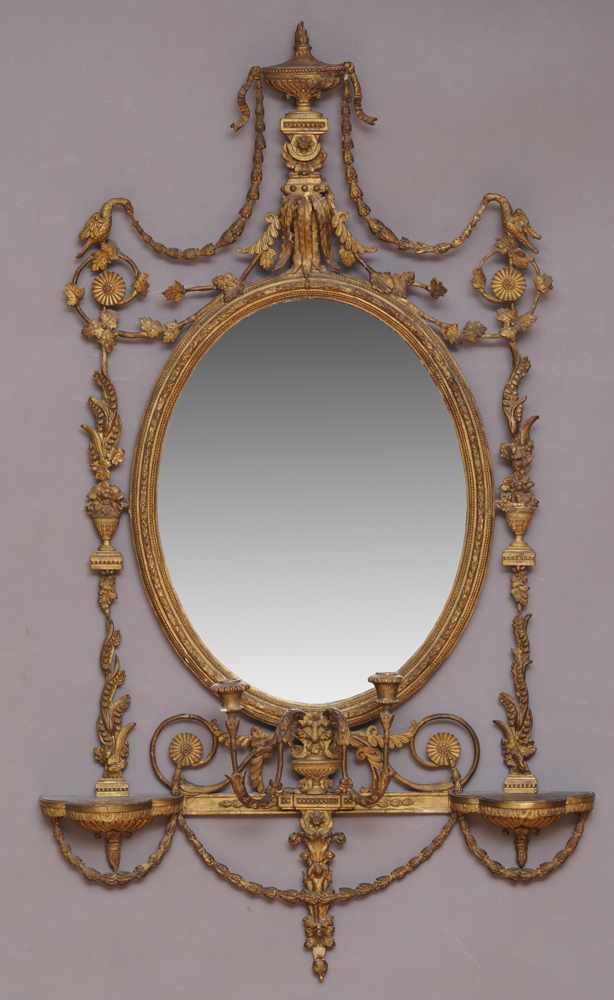 Appraisal: GEORGE III STYLE GILTWOOD OVAL GIRANDOLE MIRROR The beveled mirror