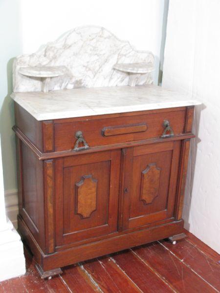 Appraisal: Victorian Walnut Washstand American late th c marble top and