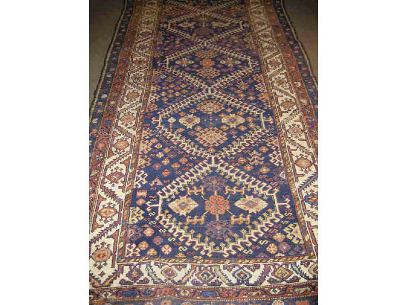 Appraisal: EARLY TH CENTURY KURDISH TRIBAL LONG RUG The indigo field