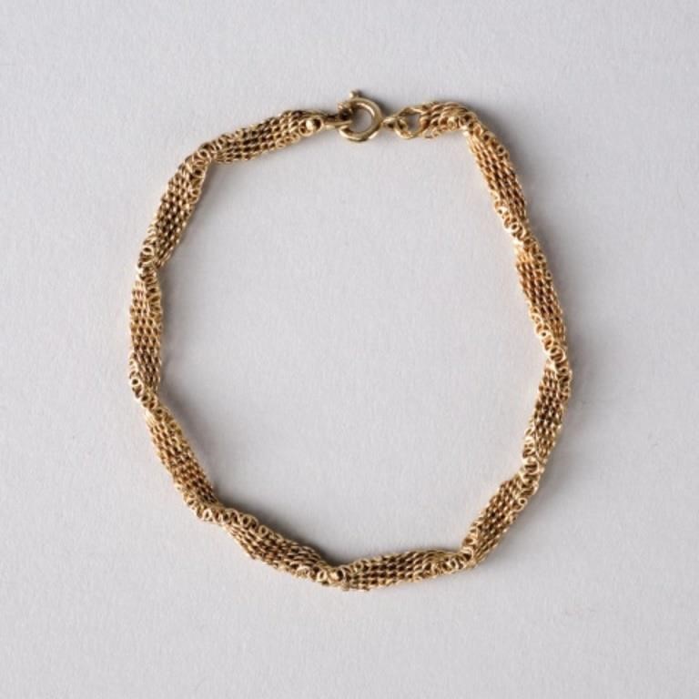 Appraisal: A twisted mesh gold bracelet with indistinct touchmarks at each