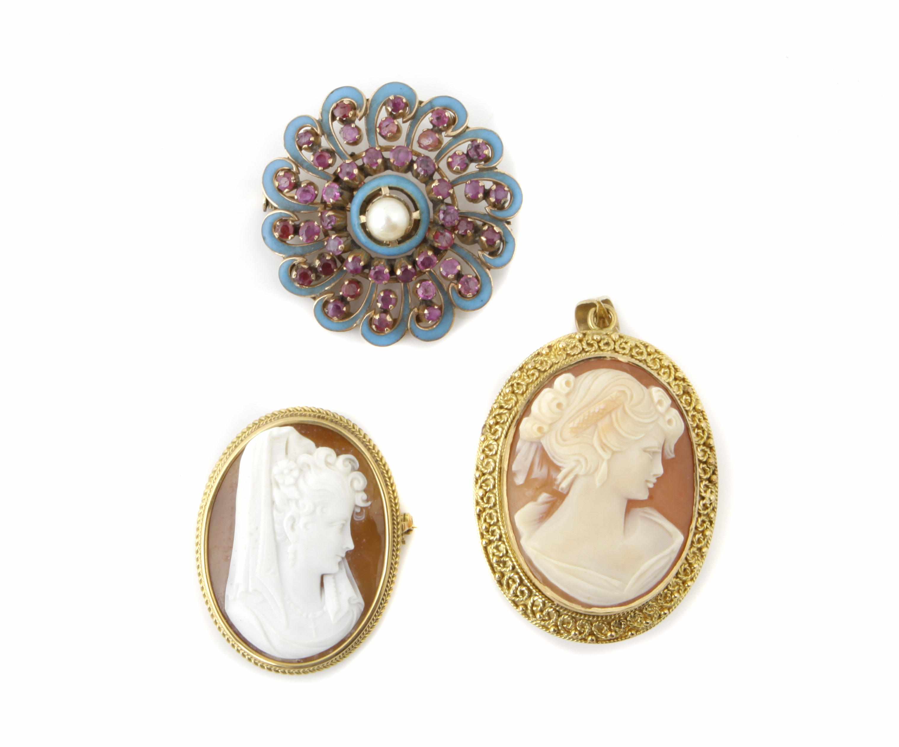 Appraisal: A collection of two gold cameo brooches and a gem-set