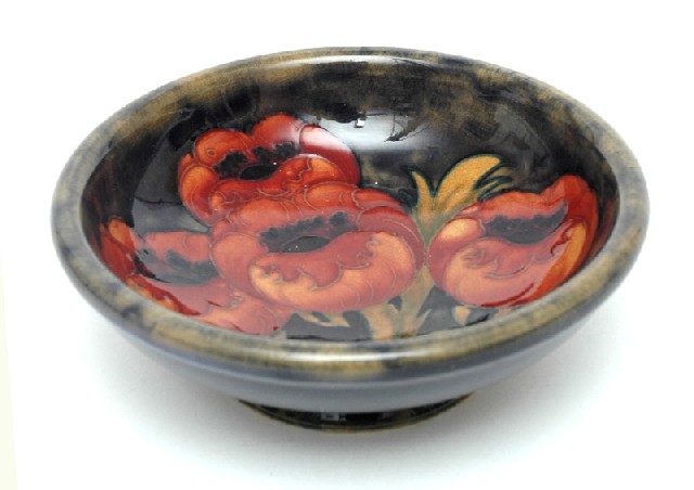 Appraisal: A MOORCROFT POPPIES PATTERN DISH Circa Circular footed dish decorated