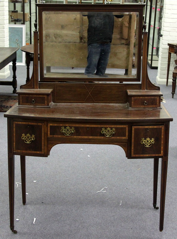 Appraisal: An Edwardian mahogany dressing table banded in satinwood on square