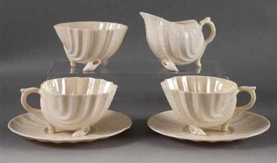 Appraisal: Two Belleek glazed parianware cups and saucers and cream and