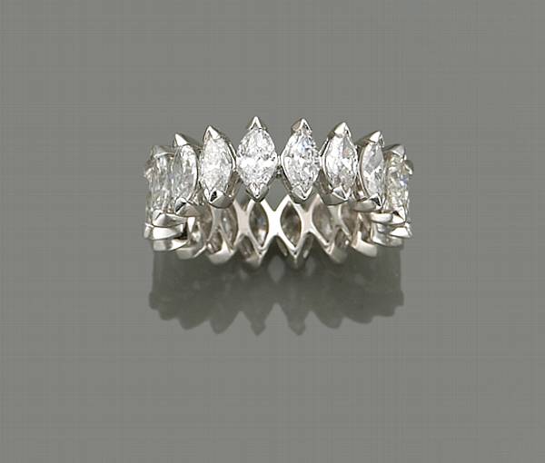 Appraisal: A diamond and platinum eternity band estimated total diamond weight