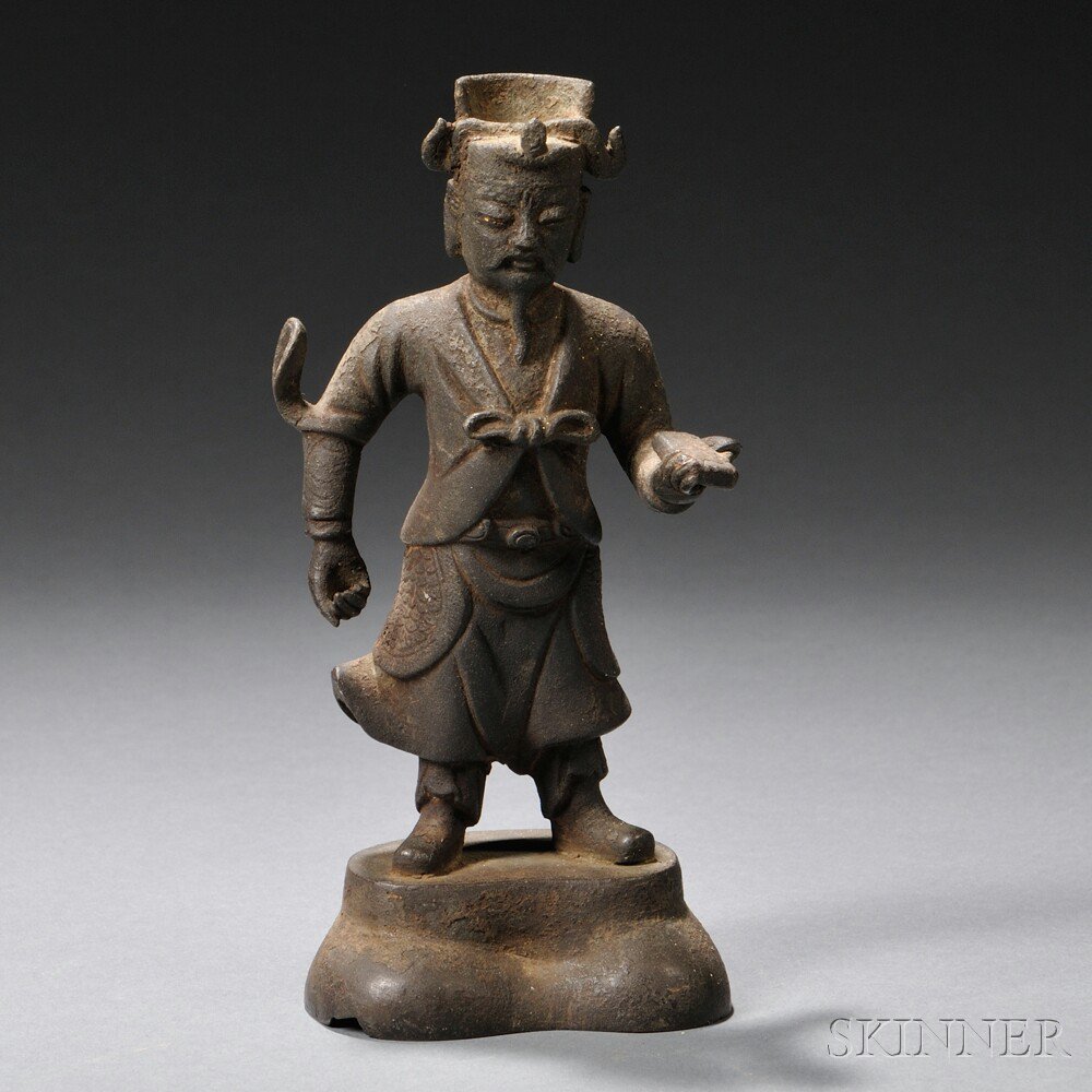 Appraisal: Iron Figurine of a Man China standing with a book