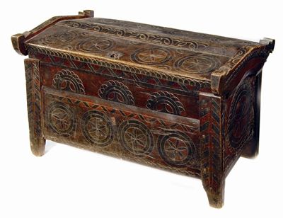 Appraisal: An Eastern European carved and painted fruitwood chest decorated with