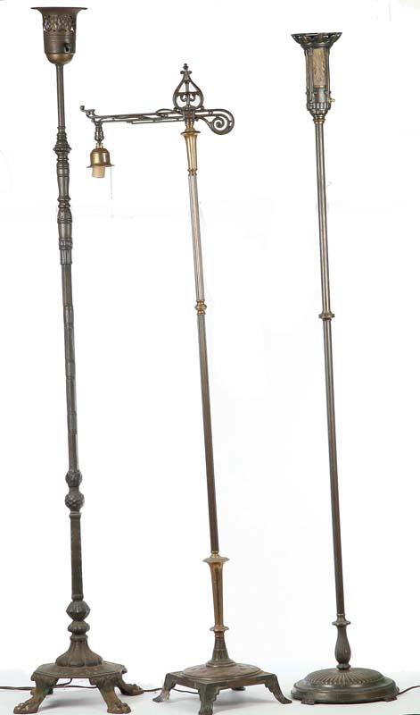 Appraisal: THREE FLOOR LAMPS Brass and white metal One bridge lamp