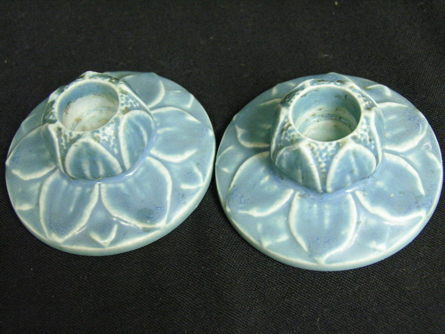 Appraisal: PAIR ROOKWOOD CANDLEHOLDERS Greenish blue leaf motif Size with diameter