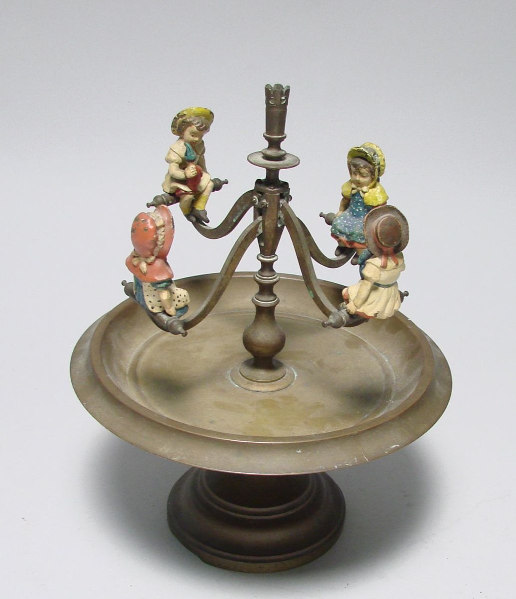 Appraisal: WHIMSICAL BRASS AND CAST IRON TOY th CenturyFour painted cast