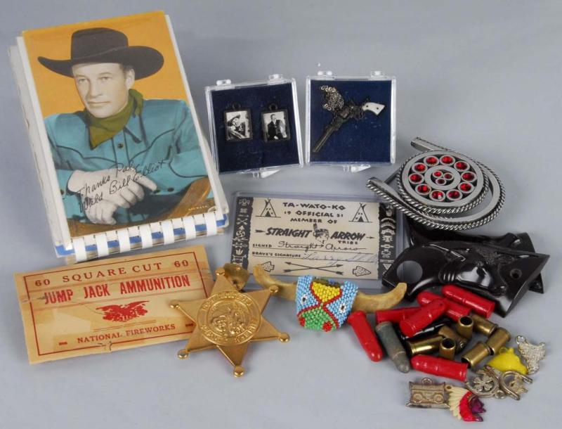 Appraisal: Miscellaneous Western Toys Description Includes post cards grips bullets charms